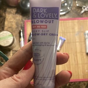 Woman’s dark and lovely blowout cream